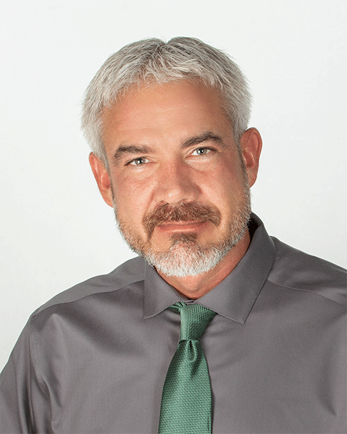 mike-headshot-owners-rep Photo of male business owner in dress shirt and tie